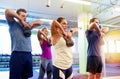 Group of people with kettlebells exercising in gym Royalty Free Stock Photo