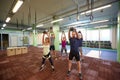 Group of people with kettlebells exercising in gym Royalty Free Stock Photo