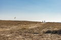 a group of people kite surfing and tourists