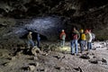 Group Of People In A Lava Tube Cave