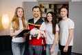 Group of people learning how to make first aid with dummy child during the training indoors Royalty Free Stock Photo