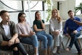 Group of people listening to lecture provided by qualified teacher