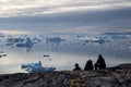 Group of people looking at icebergs in Rodebay, Greenland Royalty Free Stock Photo