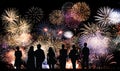 Group of people looks beautiful colorful holiday fireworks
