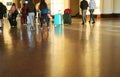 Group of people with luggage walking in arrival hall of a railway station Royalty Free Stock Photo