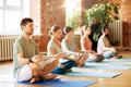 group of people making yoga exercises at studio Royalty Free Stock Photo