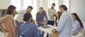 Group of people meeting in office and having discussion with senior business teacher Royalty Free Stock Photo