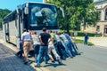 Group of people men pushing the broken bus on a country road to start the engine. Moravia Czech republic