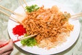 A group of people mixing and tossing Yee Sang dish with chop sticks. Yee Sang is a popular delicacy taken during Chinese New Royalty Free Stock Photo