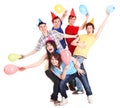 Group of people in party hat and baloon.