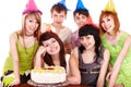 Group people in party hat with cake. Royalty Free Stock Photo