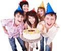 Group people in party hat eat cake. Royalty Free Stock Photo