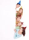 Group of people in party hat holding banner. Royalty Free Stock Photo