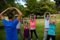 Group of people performing stretching exercise