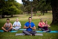 Group of people performing yoga