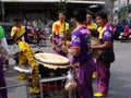 A group of people play the percussion in a Festival of the Clans of the Chinese community of Bangkok