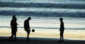Group of People playing Football on Cabourg Beach at Sunset, Normandy