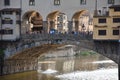 Group of people in Ponte Vecchio, the old bridge over the Arno River in Florence
