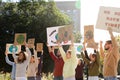 Group of people with posters protesting against climate change outdoors Royalty Free Stock Photo