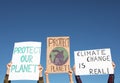 Group of people with posters protesting against climate change outdoors, closeup Royalty Free Stock Photo