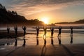 People practicing yoga on a beach