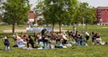 Group of people practicing yoga in a city park of Bologna. Italy