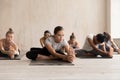 Group of people practicing yoga, Head to Knee Forward Bend Royalty Free Stock Photo