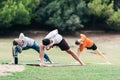 Group of people practising yoga on a park Royalty Free Stock Photo