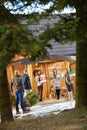 Group people preparing mountain house for New Year eve