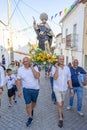 group of people in procession in honor of Santo Domingo promoted by the parish of the Portuguese village of Malpica do Tejo.