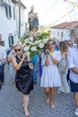 group of people in procession in honor of Santo Domingo promoted by the parish of the Portuguese village of Malpica do Tejo
