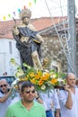 group of people in procession in honor of Santo Domingo promoted by the parish of the Portuguese village of Malpica do Tejo