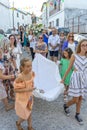 group of people in procession in honor of Santo Domingo promoted by the parish of the Portuguese village of Malpica do Tejo