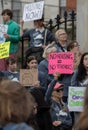 Group of people protesting for social equity and affordable housing in the streets of Boston, USA