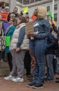 Group of people protesting for social equity and affordable housing in the streets of Boston, USA