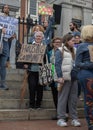 Group of people protesting for social equity and affordable housing in the streets of Boston, USA