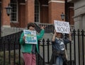 Group of people protesting for social equity and affordable housing in the streets of Boston, USA