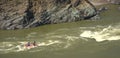 A group of people on rafting overcome the rapids of the mountain river Katun