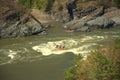 A group of people on rafting overcome the rapids of the mountain river Katun