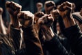 Group of people raising their hands in the air with their fists raised. Generative AI Royalty Free Stock Photo