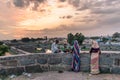 A group of people on the ramparts of the ancient Vellore Fort complex and enjoying a