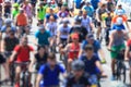 Group of people ride bikes on the road