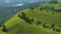 Group of people ride horses by gorgeous mountainside trail. Royalty Free Stock Photo