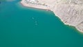 A group of people ride sup surfing in the lake.