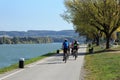 Group of people riding bicycles along the Danube river. Lower Austria.