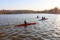 A group of people are riding a kayak