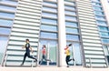 Group of people running in modern urban city area