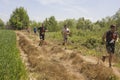 Group of people running outdoor in a field in Tuscany Royalty Free Stock Photo