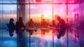 A group of people are sitting around a table in a conference room AIG41 Royalty Free Stock Photo