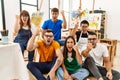 Group of people sitting at art studio annoyed and frustrated shouting with anger, yelling crazy with anger and hand raised Royalty Free Stock Photo